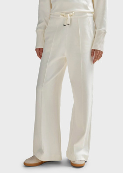 Молочные брюки Hugo Boss расклешенного кроя, фото
