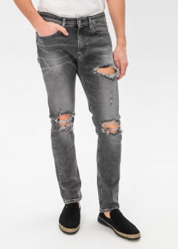 Рваные джинсы Calvin Klein серого цвета, фото