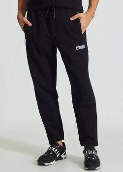 Спортивные брюки EA7 Emporio Armani с карманами на молнии, фото